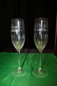 lot 339 image: Champagne Glasses (includes Bride and Groom glasses) with (2) Dish Racks - each holds up to 36 glasses