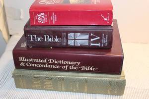 lot 29 image: Large Family Bible, Large Bible DictionaryConcordance, the Bible in a Year, and the Bible on Cassette