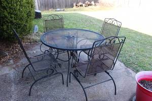 lot 116 image: Patio Table and 4 Rocking Chairs See Photos