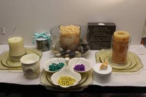 lot 132 image: Home Decor items, including candles and candle holders, trinket box with Seashell on the lid, unopened paper and pen, and anchor hoking vintage yellow plates