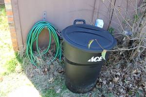 lot 180 image: Garden Hose, sprayer,holder and Ace Trash Can
