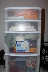 lot 126 image: Plastic Drawers Filled with Various Table Linens, including Table Cloths, napkins, and table Runners