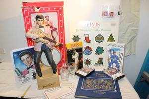 lot 150 image: Vintage Elivs Presely Decanter, Christmas Album, Tapes and Books, Elvis Presely Collector Stamps (3)