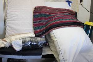 lot 241 image: Large Wedge Pillow, Seat Cushion, Two Bed Pillows, A Blanket, And Several Silk Pillow Cases