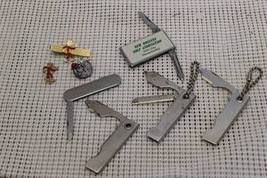 lot 242 image: Vintage Reddy Kilowatt Items, and Small Key chain size Tools as shown