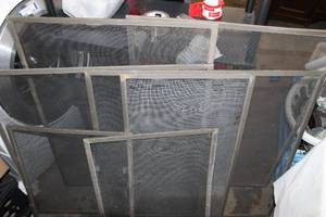 lot 254 image: Aluminum Window Screens, the screens all have holes or tears,, Frames are in condition and can be rescreened