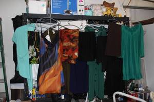 lot 279 image: Ladies Blouses, skirts, and Dresses in styles and colors as shown