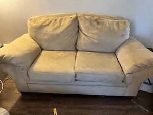lot 297 image: Love seat, appears to be microfiber Just needs to be Cleaned