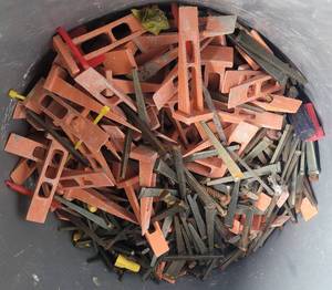 lot 124 image: LOT OF MASONRY NAILS AND MORE AS SHOWN.