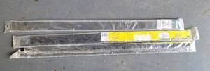 lot 147 image: (3) DELUXE ALUMINUM AND VINYL DOOR SWEEPS IN PACKAGES AS SHOWN.