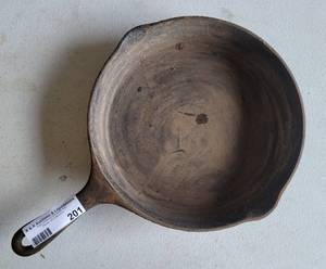 lot 201 image: CAST IRON SKILLET AS SHOWN.