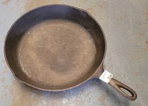 lot 234 image: LODGE CAST IRON SKILLET AS SHOWN.