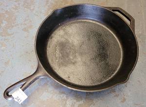 lot 243 image: LODGE CAST IRON SKILLET AS SHOWN.