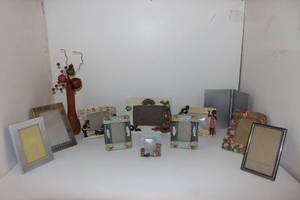 lot 13 image: Variety of  photo frame and vase with flowers