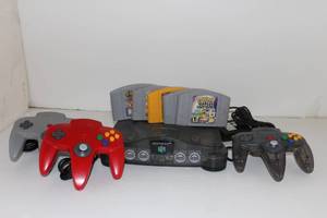lot 15 image: Nintendo 64 with 5 Games, 3 Controllers and Power Cord, Condition Unknown