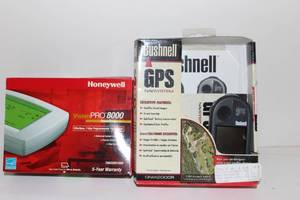 lot 65 image: Bushnell GPS, Honeywell Programable Thermometer in Box