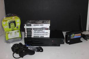 lot 101 image: Playstation 2 System and games With Paperwork