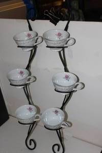 lot 148 image: Rose Swirl tea cups and saucers with decorative display