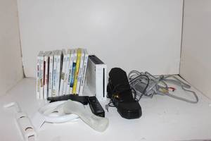 lot 174 image: Nintendo Wii and Games and Paperwork