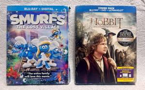 lot 16 image: Blue Ray DVD - Smurfs The Lost Village The Hobbit Combo pk