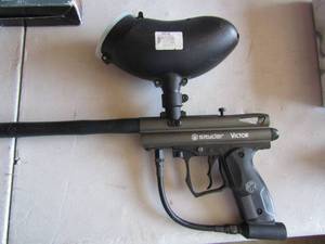 lot 33 image: Spider Victor paint ball gun used once, has a small whole in the lid where it holds the paint balls
