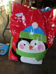 lot 88 image: Large Christmas bag full of smaller decretive Christmas gift bags, some new and some used