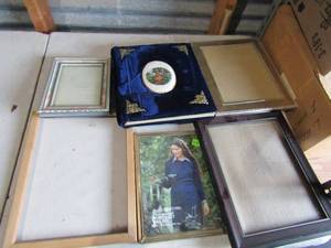 lot 102 image: Small box full of new and a few used picture frames, sizes range from 48 thru 810 most of all are wooden frames