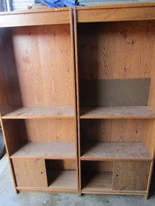 lot 130 image: Brown 3 tier book shelfs both have bottom sliding doors with small storage space, well used still lots of life, both are 602410