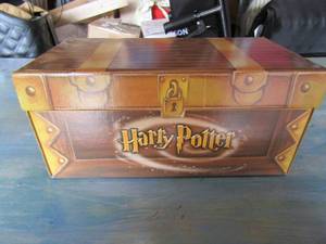 lot 28 image: Harry potter box of new and used Harry potter figurines and toys