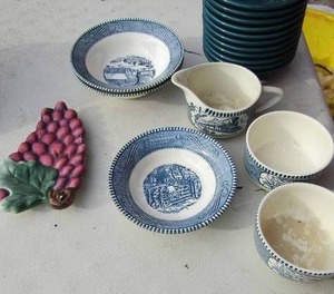 lot 14 image: Fiesta ware bowls qty 11 forest green in color, blue and white dishes includes, creamer dish, 2 handled coffee hot tea cups, 3 bowls