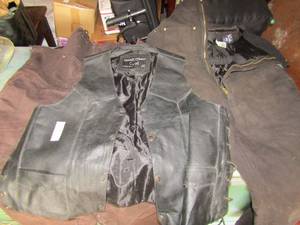 lot 10 image: Large size black leather road wear biker vest, large size,  Walls coveralls black in color, XL   Walls coveralls brown in color both pair used