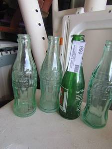 lot 166 image: 3 vintage glass coke bottles, 1 vintage 7 up bottle qty together is 4