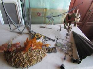 lot 178 image: Yard and outdoor hanging dcor, metal wall vase, Metal god riding a bike, 1 plant stand