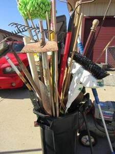 lot 39 image: black outdoor trash can includes indoor floor cleaning items such as mops, brooms, and dusters also includes outdoor yard racks, hos, scrapers and more