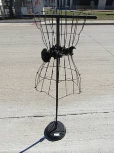 lot 18 image: clothing metal designer rack, for measurments and more on a black stand