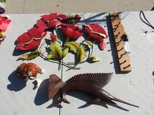 lot 13 image: glass puppy dog with a boken foot, foot is included, wooden tuna fish statue metal flower wall art, and a wooden wall key hanger