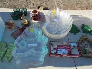 lot 76 image: Christmas lot includes, plstic Santa and snowman plates, crystal candle holder, 4 votive candle holders, set of angel wings gold, 2 green Christmas tree candy dish dcor