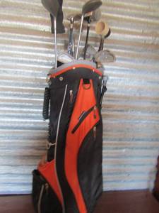 lot 88 image: orange and black golf bag with silverscot mixture of golf clubs qty 13 and a ball scoop