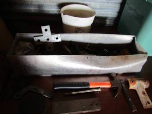 lot 92 image: metal draw full of clamps, screws, bolts, nuts, hammers, brakets and a white bucket of nails and screws