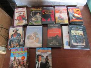 lot 105 image: DVDS & VHS TAPES Lot includes the notebook, tomebstone, the horse wisper, the bulls and more