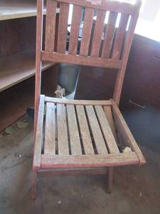 lot 111 image: outdoor wooden chair needs repairs also folds