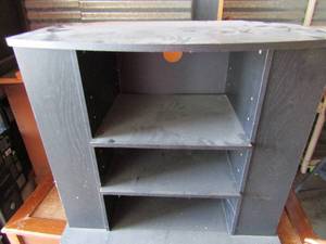 lot 114 image: black tv table with 3 tier storage 29x34x20 has storage on side for movies