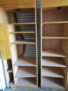 lot 119 image: 2 entertainment center piece for books,movies,snacks etc., door needs repaired on one , has 2 glass front doors and 2 wooden doors that need attached also have lights at the top 6 12 ft x 31 x 19 per shelf qty 2