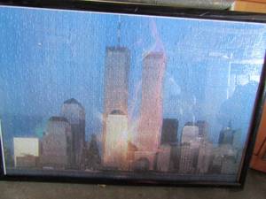 lot 122 image: Framed Puzzle of downtown NEW YORK with theTwin Towers 21x31