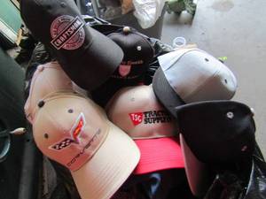 lot 144 image: black trash bag full of brand new mens baseball caps all kinds