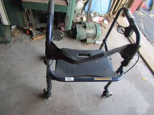 lot 149 image: four wheel walker with handles and a seat unknown name