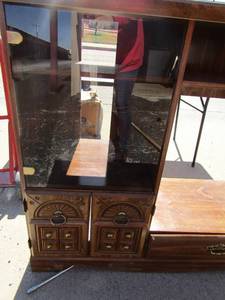 lot 151 image: tv entertainment center 1 glass front door, 1 drawer for movie storage  44x48x18
