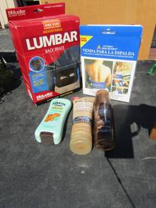 lot 157 image: brand new back wrap one size fits all moiste heat without adding water, lumbar back brace maximum support one size fits all,used bottle of lion tropical lotion, jergens natural glow and lotion