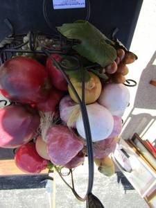 lot 158 image: metal handled basket with various pieces of waxed fruit