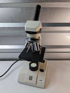 lot 104 image: National Microscope Model 138 3 Objective Lenses Bottom Lighting Monocular
